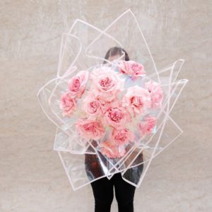 Dozen Pink Roses in White Wrap